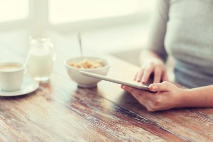 Browsing online at breakfast table