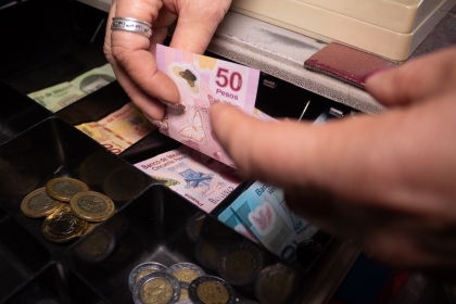 Cash register with notes and coins