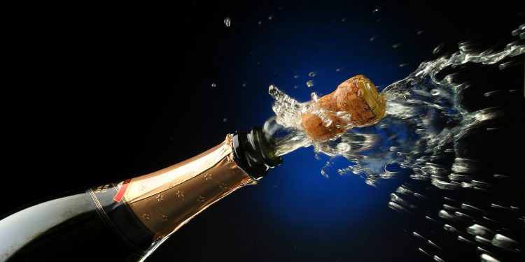 Bottle of Champagne being popped