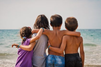 Children together by the ocean