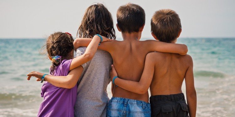 Children together by the ocean