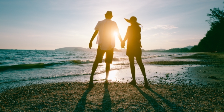 Romantic couple on the beach at sunset