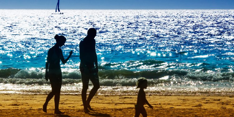 Family walking on a beach