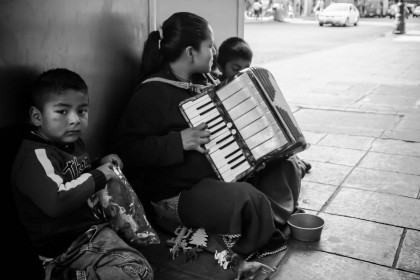 Family playing accordion for tips in Mexico City. Mundial Photo