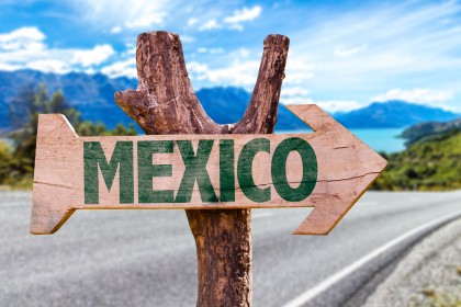 Sign Pointing to Mexico