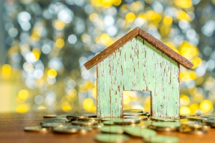 House and coins finance concept