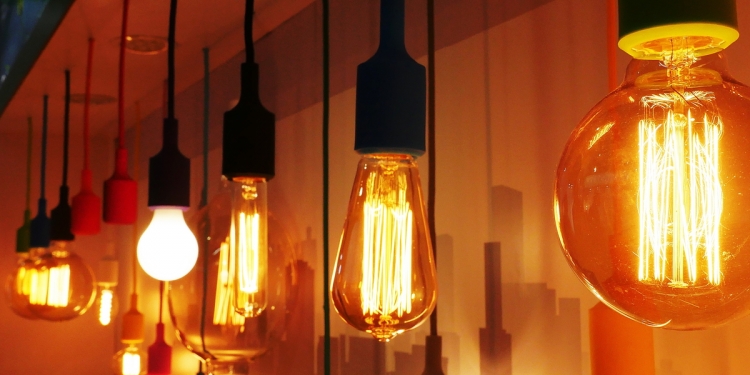 Different types of light bulbs hanging a in a row