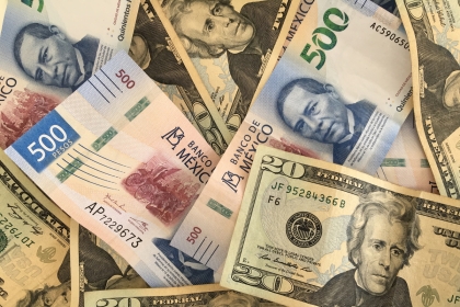 Mexican peso and US dollar banknotes
