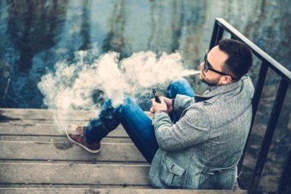 Man vaping outdoors
