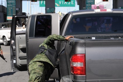 Soldier Checks Vehicle in Mexico