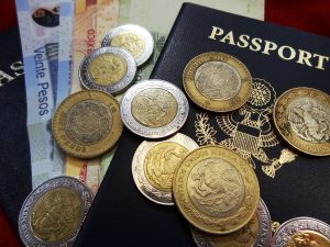 US Passport and Mexican Pesos