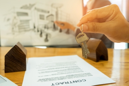 Property contract on a table with keys