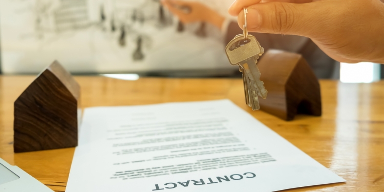 Property contract on a table with keys