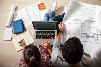 Couple reviewing a property plan