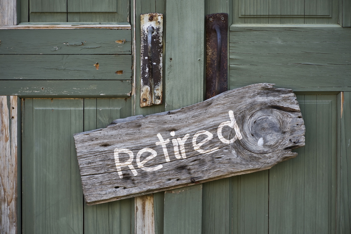Retired sign on a wooden door