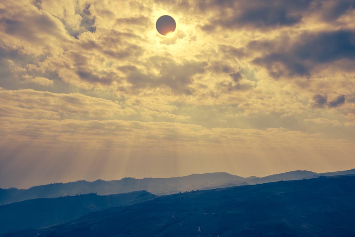 Solar Eclipse over a mountain