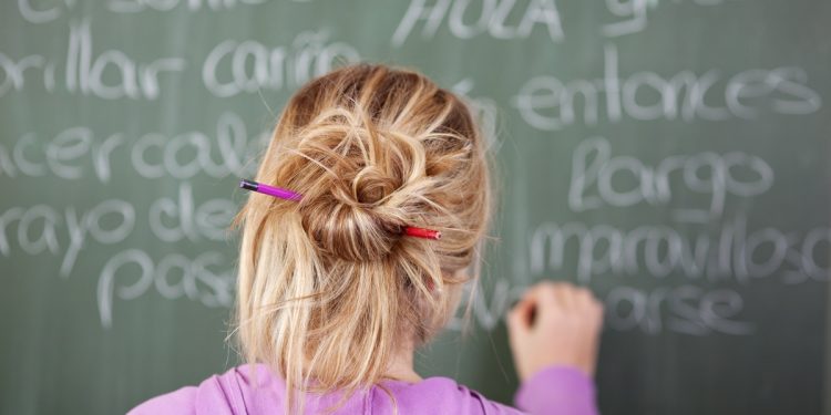 Writing Spanish on a chalkboard
