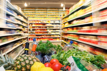Supermarket trolley filled with groceries