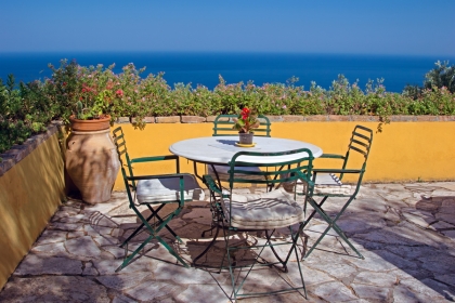 Table and chairs with a sea view