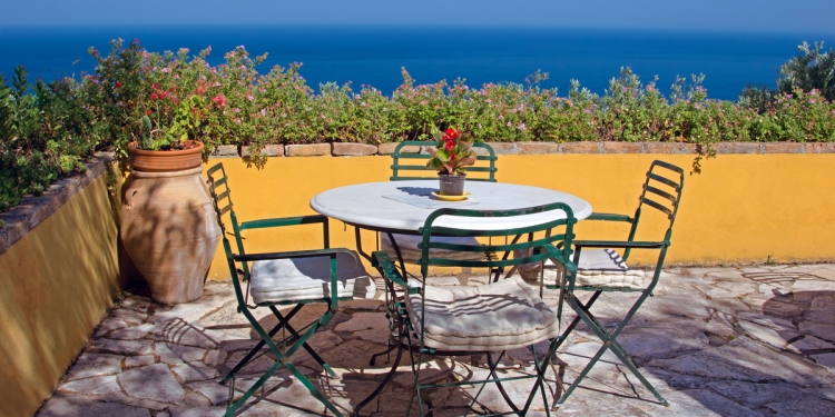 Table and chairs with a sea view