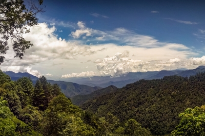 Clouds forming over a mountain valley
