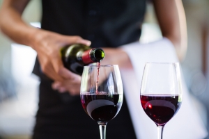 Wine Being Poured into Glasses