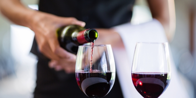 Wine Being Poured into Glasses