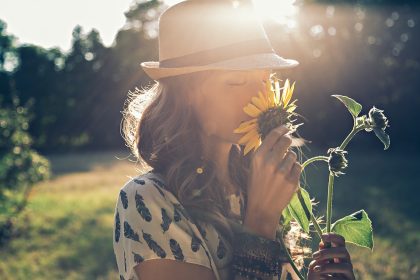Woman Smelling Flowers
